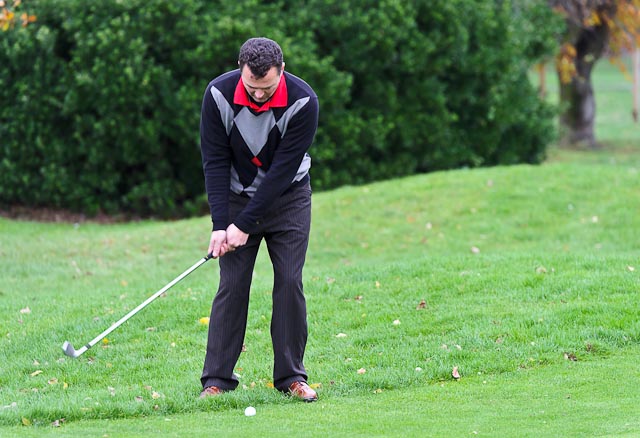 Swing the club back predominantly with the arms