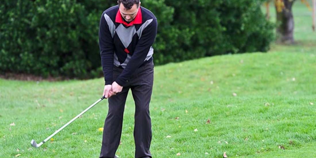 Swing the club back predominantly with the arms