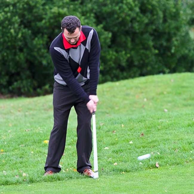 Keep the arms moving forward to prevent the hands flicking the club head
